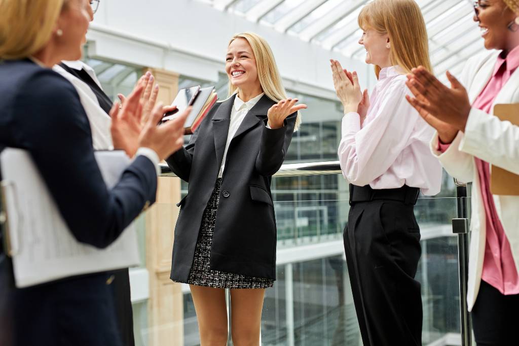 Happy business women meeting in person