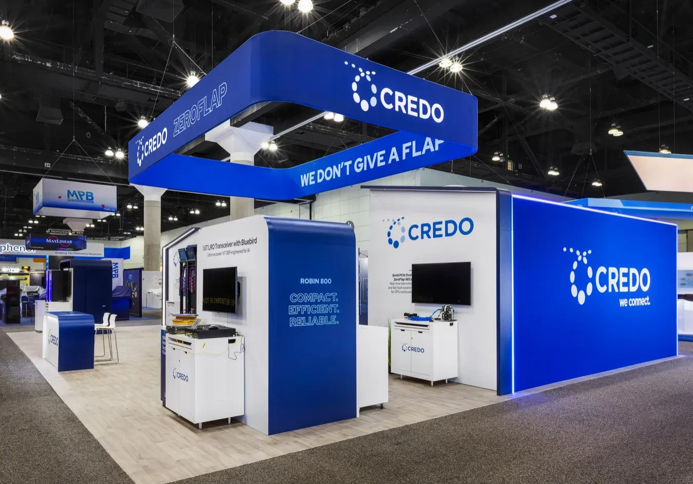 Credo trade show booth hanging sign and product kiosks by art and display